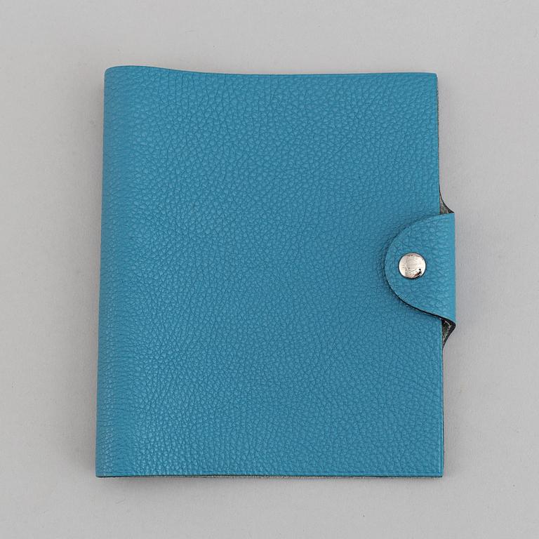 Hermès, a blue leather notebook with two scripple pads.