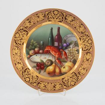 Two gilded and painted plates, around 1900.