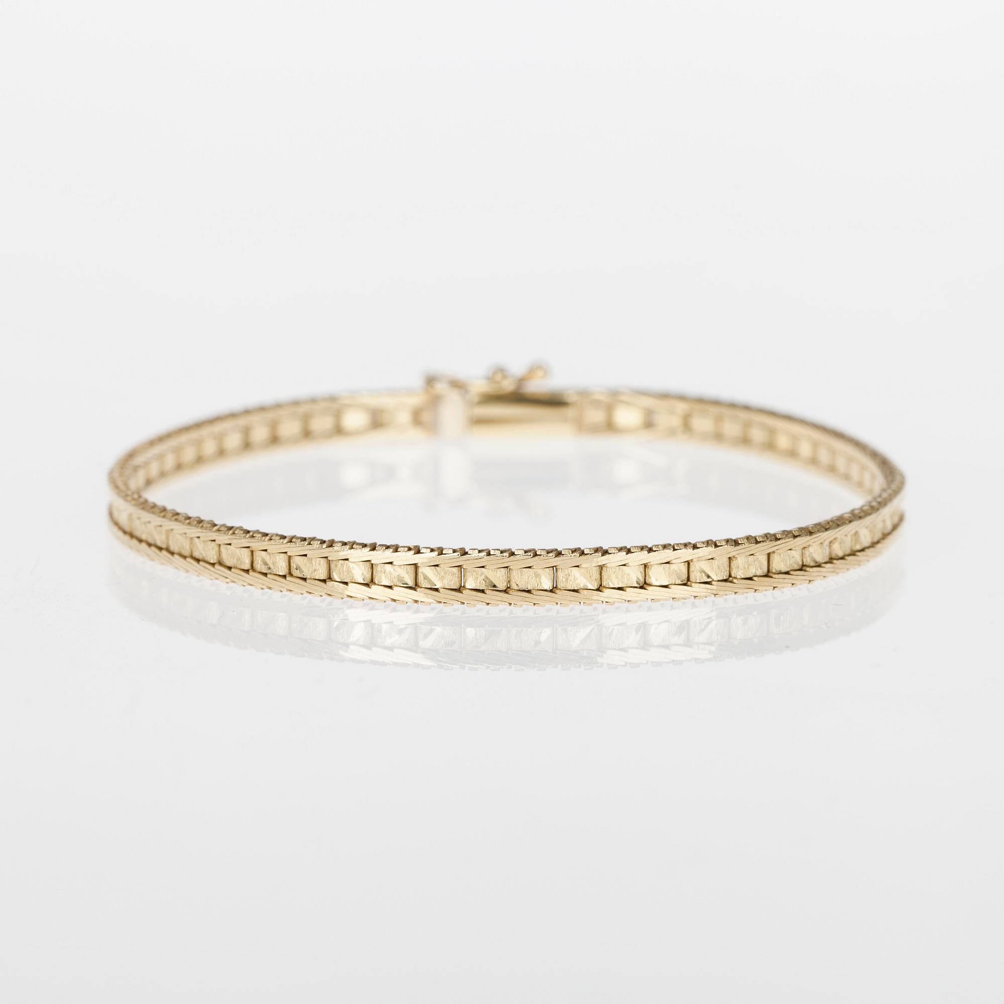 ARMRING och RING, 14/18K guld, briljantslipad diamant ca 0,15 ct. Vikt tot. 12,2 g.