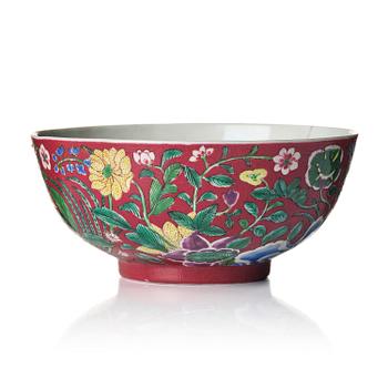 832. A rare large ruby ground 'yangcai' floral bowl, Qing dynasty, 18th century.