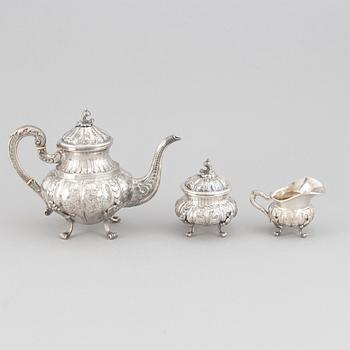 A silver teapot, creamer and sugar bowl, swedish import mark.