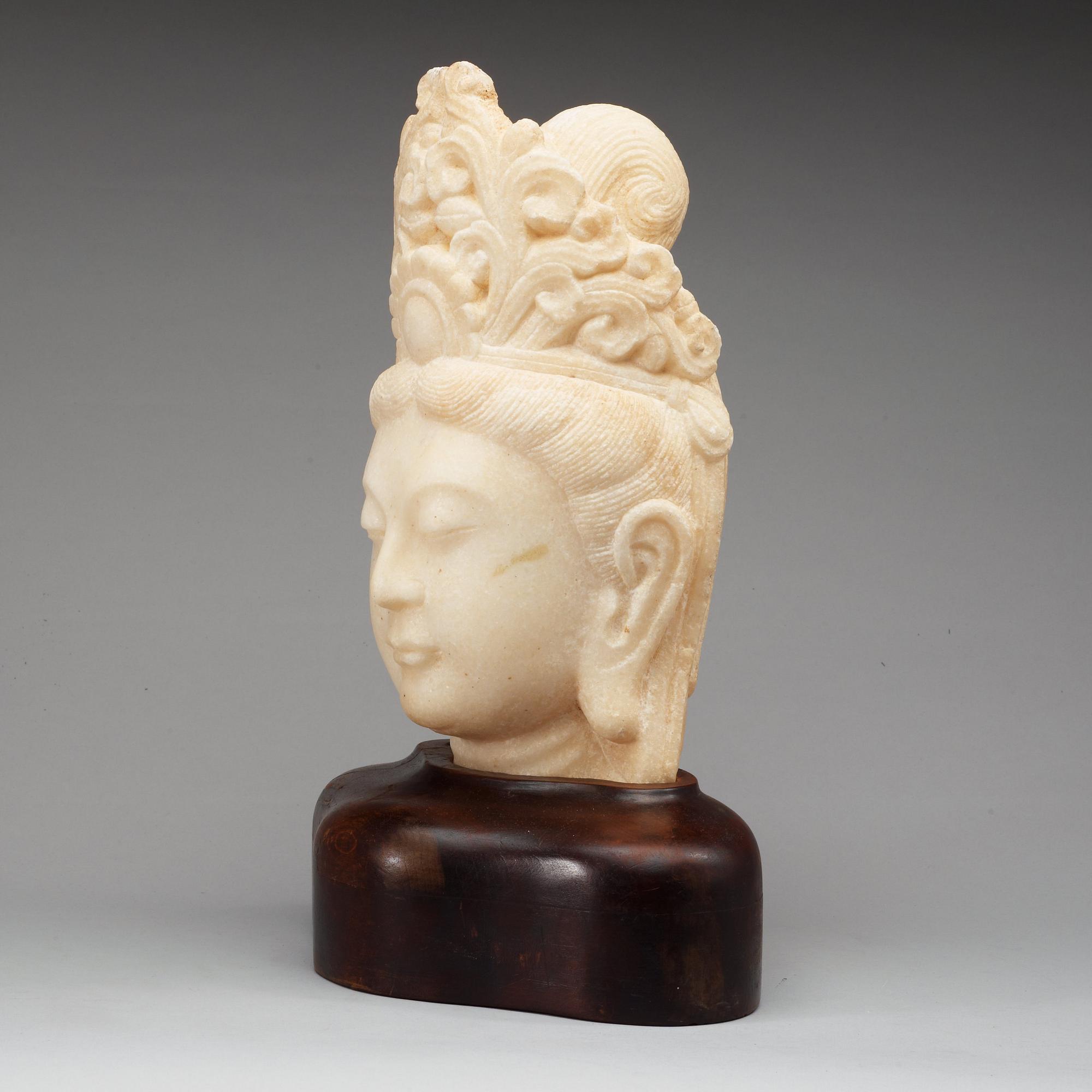 A marble sculpture of Guanyin, China.