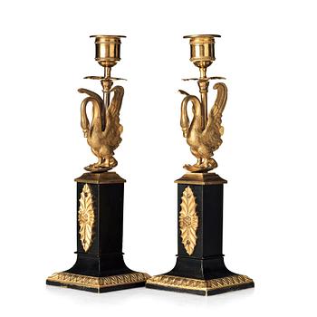 A pair of Empire early 19th century candlesticks.