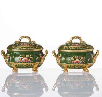 A pair of armorial butter tureens with covers and stands and two fruit dishes, Derby, England, circa 1830.