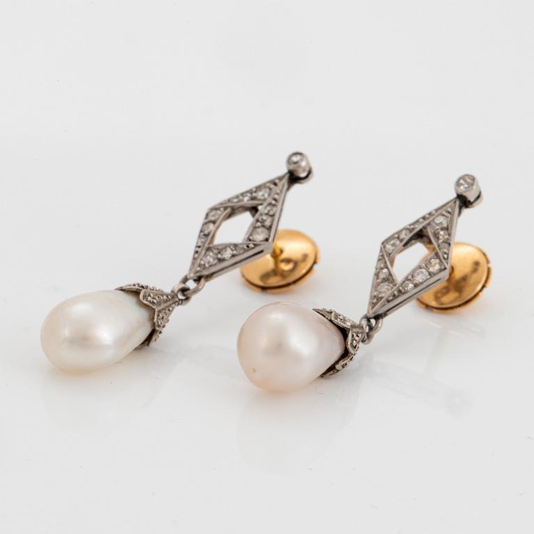 A pair of platinum and natural pearl earrings.
