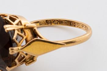 2 RINGS, 18K gold w smoky quartz approx 14 mm, silver and gold w rock crystal approx 16 mm, Stockholm 1963.