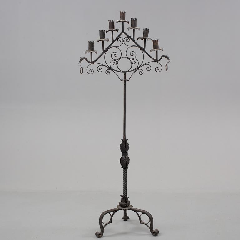 A metal floor candelabra, first half of the 20th century.