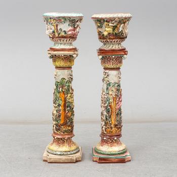 A pair of second half of the 20th century cream ware pedestals with flower pots, Capo di Monte, Italy.