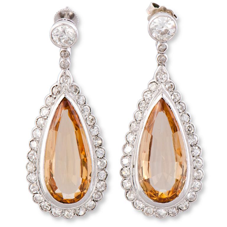 KORVAKORUT, viistehiotut topaasit, vanha- ja 8/8-hiotut timantit, platinaa.