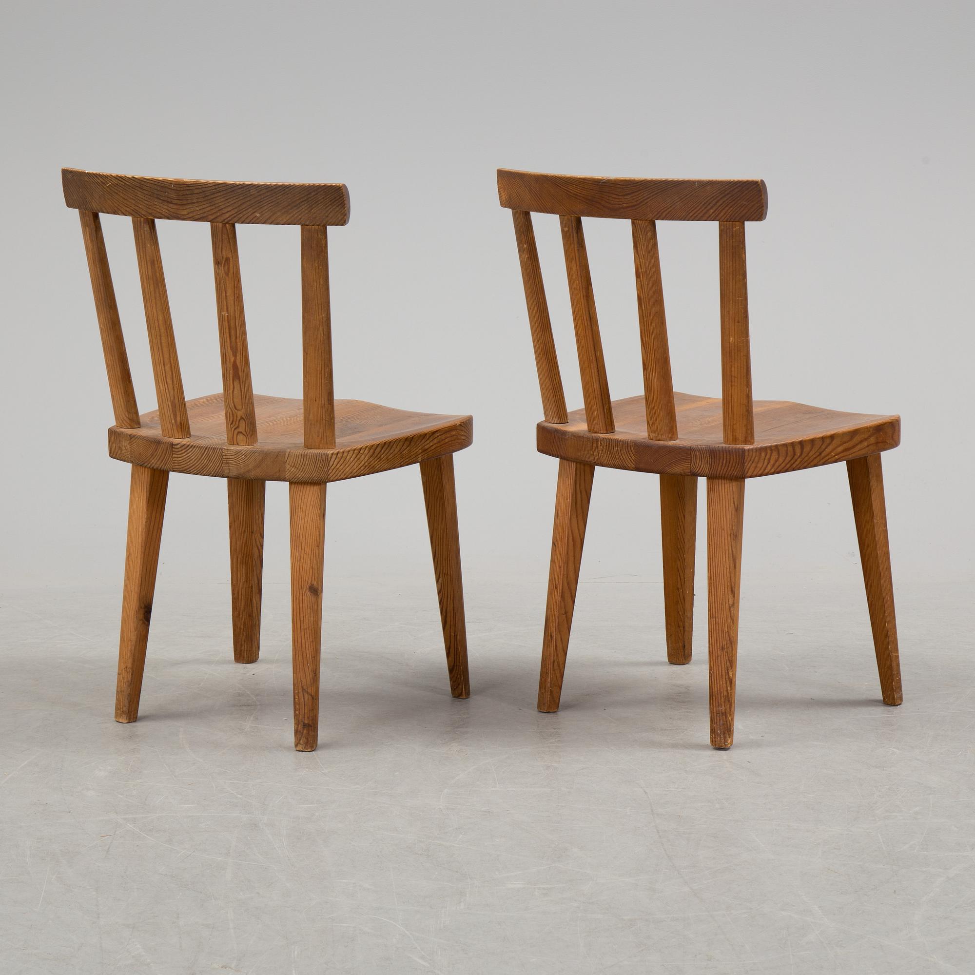 A pair of "Utö" pinewood chairs by Axel Einar Hjorth in the 1930's.
