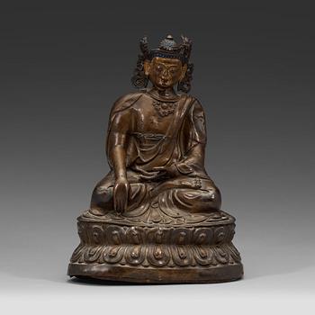 498. A copper alloy and gilt repoussé Bodhisattva, 17th/18th century.