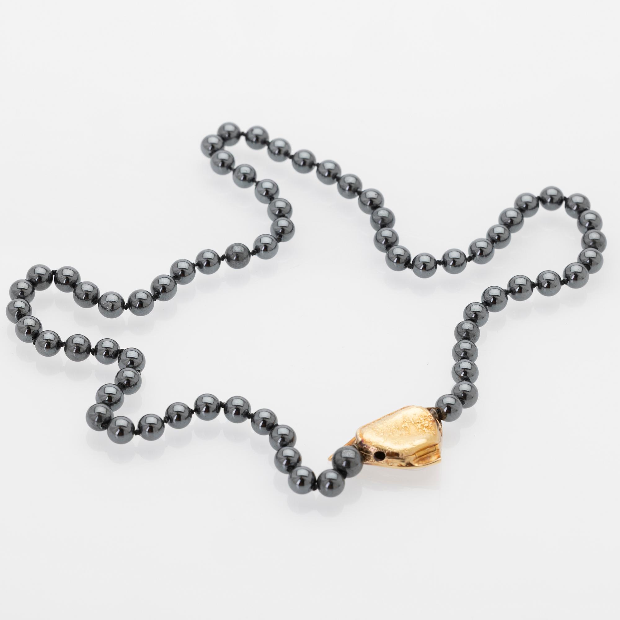 Ole Lynggaard, Hematite necklace with an 18K gold clasp and a diamond.