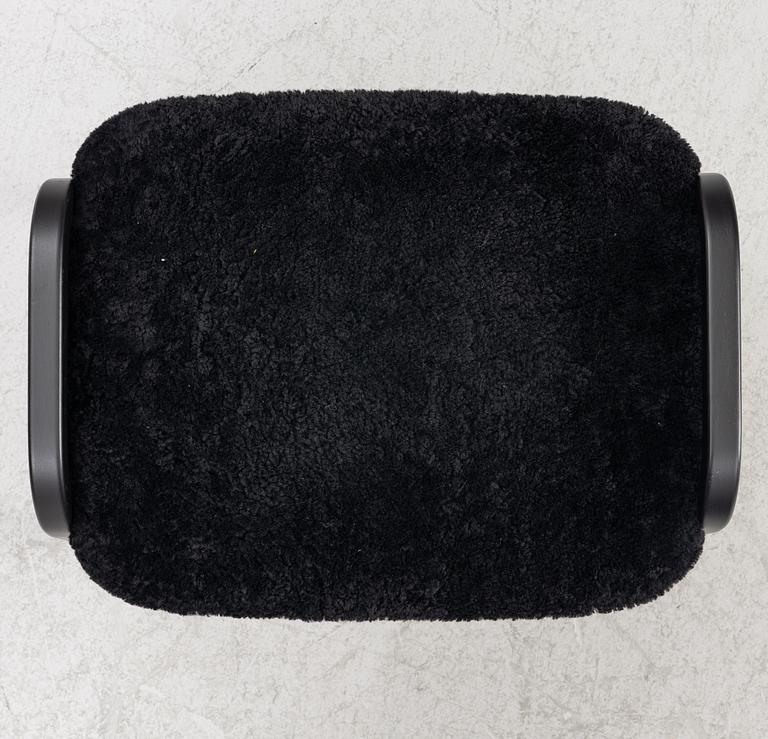 Yngve Ekström, a  'Lamino' easy chair with foot stool, Swedese, 2018.