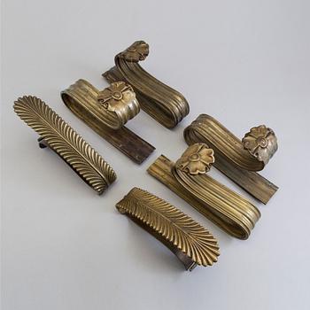 SIX BRONZE CURTAIN TIE-BACKS (4+2), 19th century.