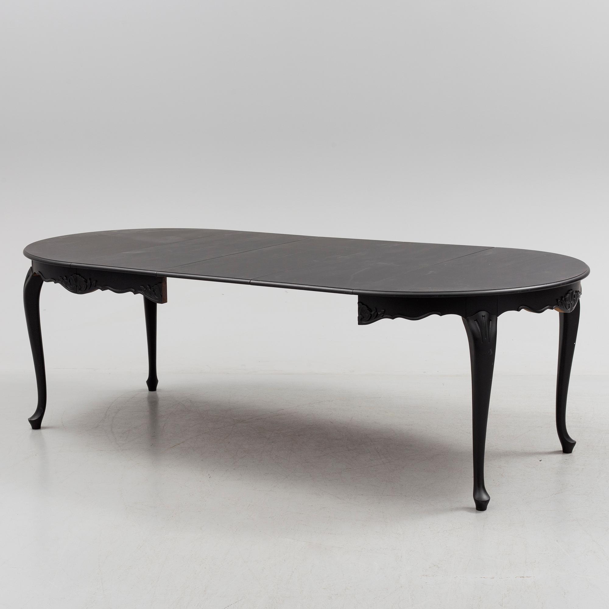 A mid 20th century rococo style dining table.