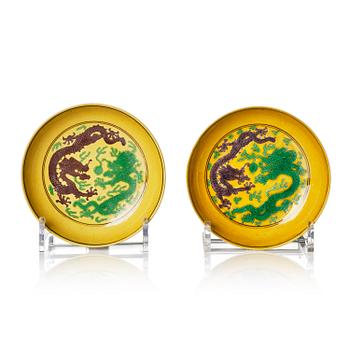 958. A pair of yellow ground aubergine- and green-enamelled 'dragon' dishes, Qing dynasty, Daoguang seal mark and period.