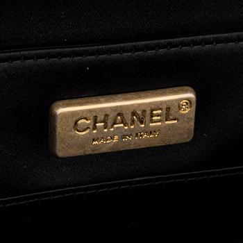 Chanel, a black satin clutch, 2019.