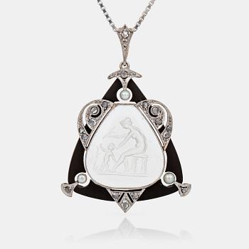 468. A possibly Viennese rock-quartz intaglio pendant set with, onyx, rose-cut diamonds and seed pearls.