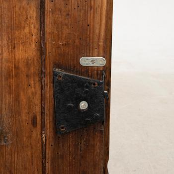 Wall-mounted cabinet dated 1804.