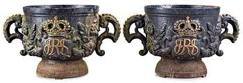A pair of Swedish cast iron garden urns with Royal monogram, probably second half 19th century.