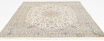 A Keschan carpet, signed, c. 350 x 245 cm.