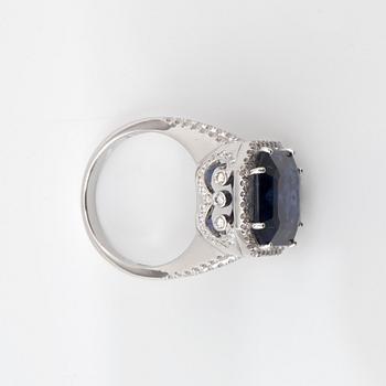 An iolite, 8.44 cts, and brilliant-cut, 1.11 cts in total, diamond ring.