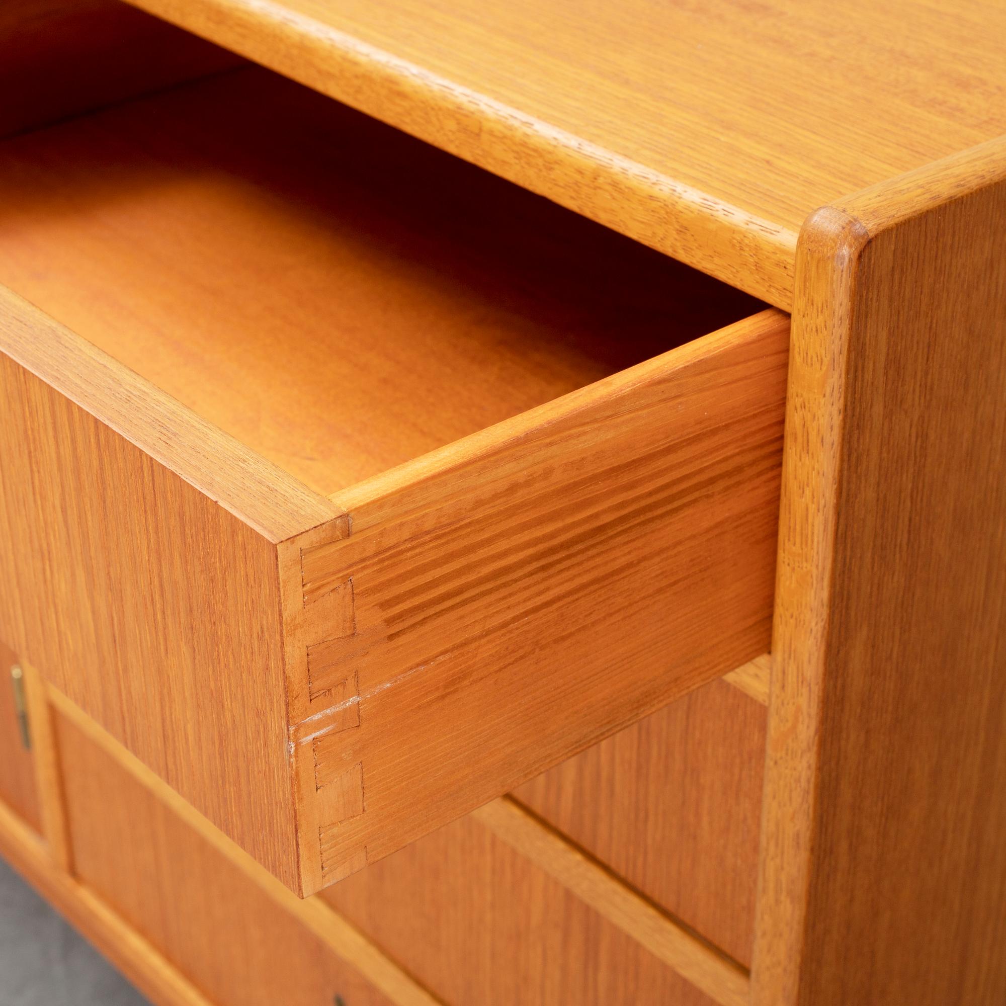 A second half of the 20th century teak veneered sideboard.