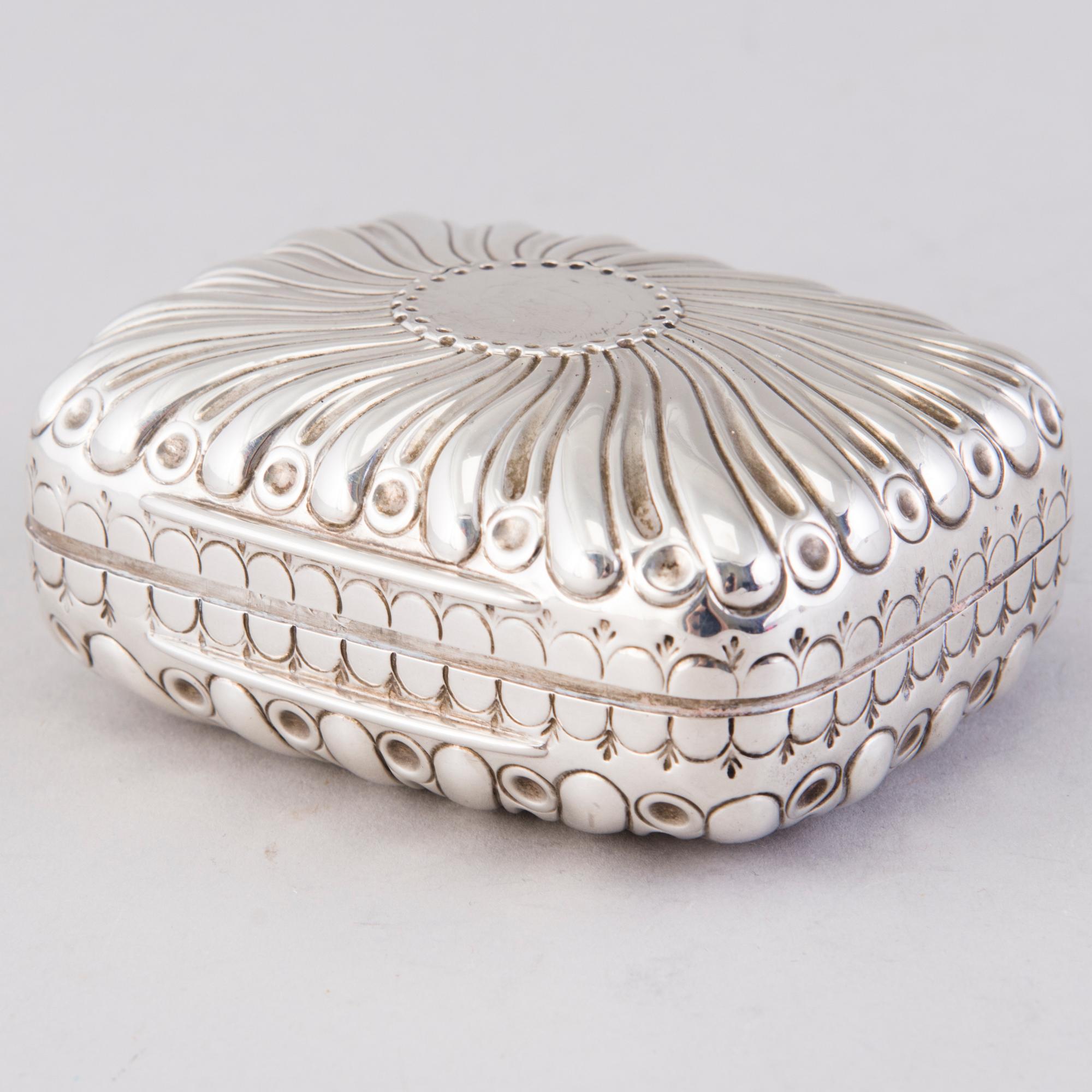 A hinged parcel-gilt soap case, London 1884.