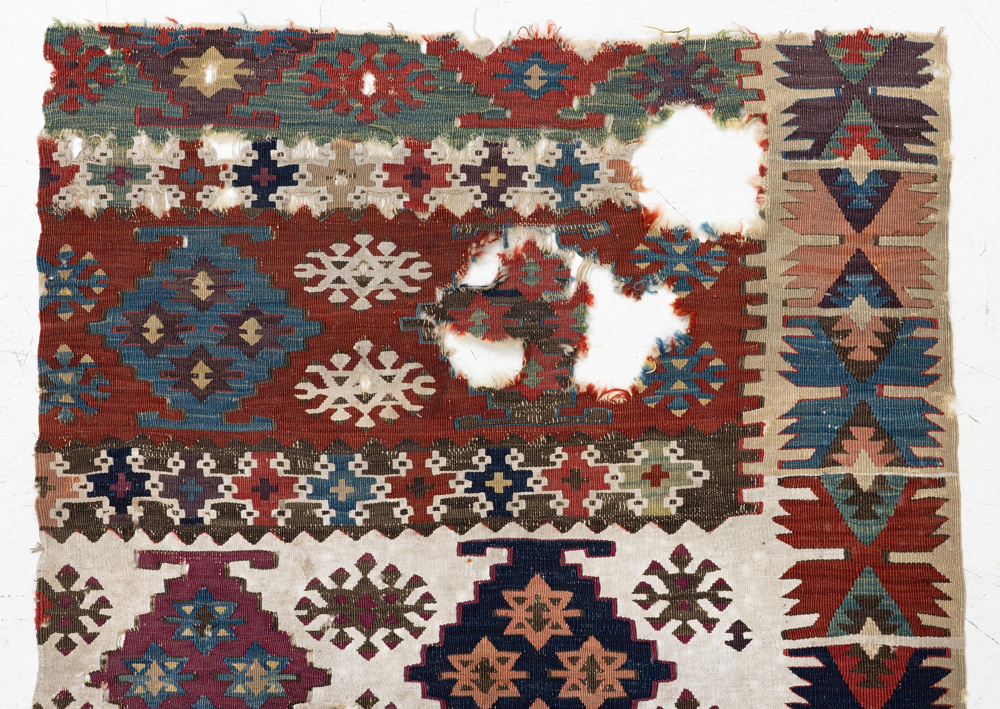 An antique kilim fragment, central Anatolia, c. 238 x 82 cm.