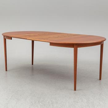 A 1960s teak veneered dining table.
