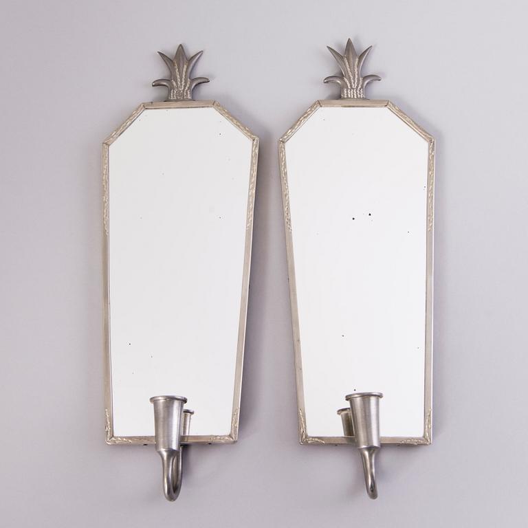 A pair of 1930s mirrored wall sconces.