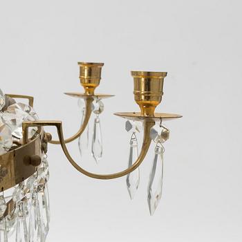 A contemporary Empirestyle chandelier for eight candles.