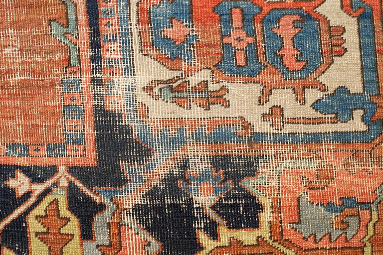 A carpet, an antique Heriz, ca 469,5-471 x 300-309,5 cm.