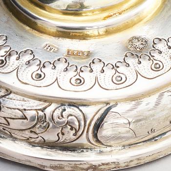 A pair of Russian Baroque parcel-gilt silver cups and covers, mark of Nikifor Timofeev, Moscow 1729.