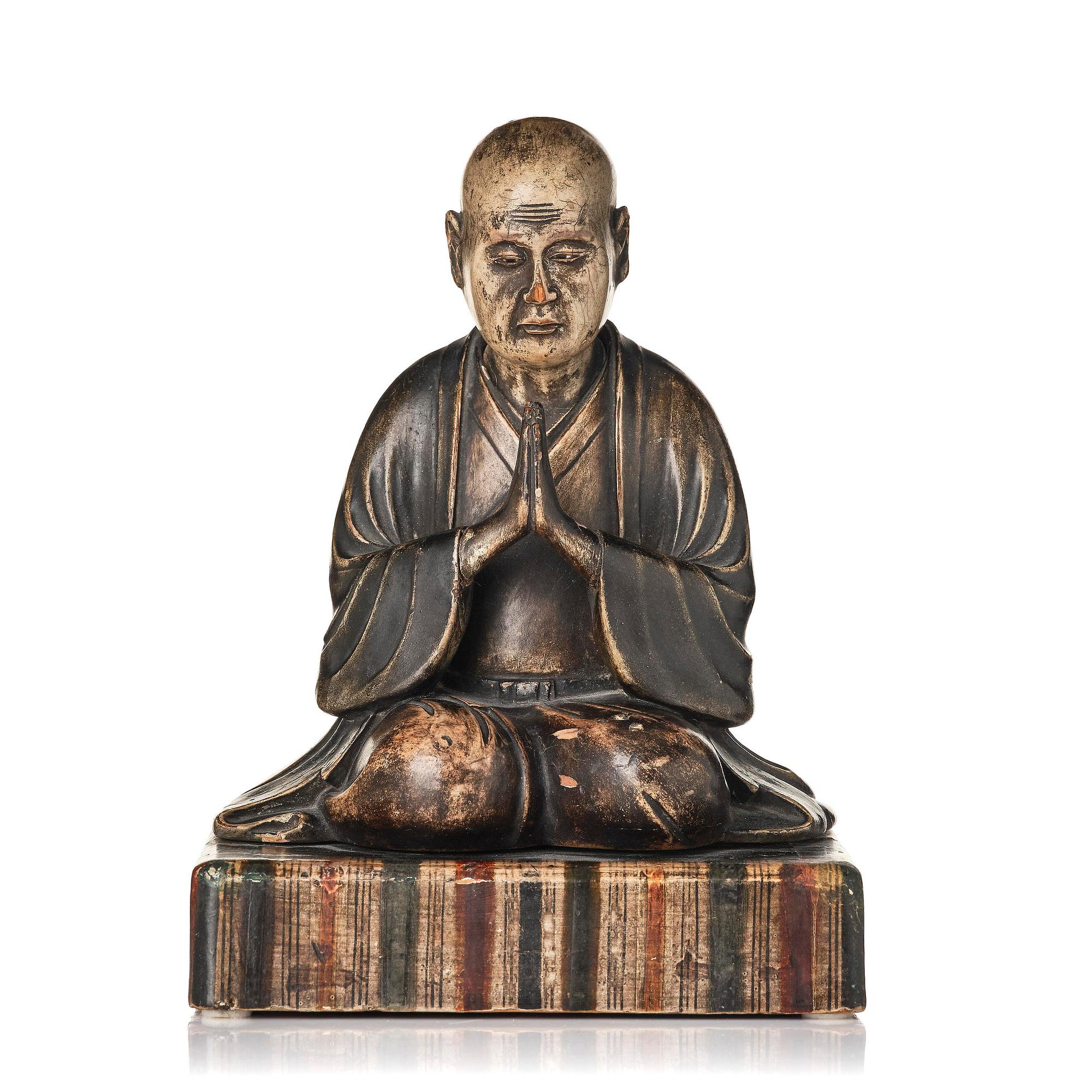 A painted and lacquered wooden sculpture of a monk, Japan, 19th century.