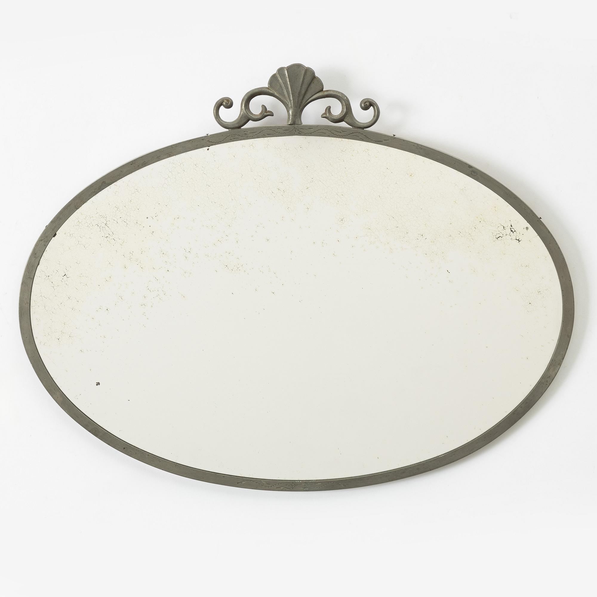 A Swedish Grace pewter mirror, 1920s/30s.
