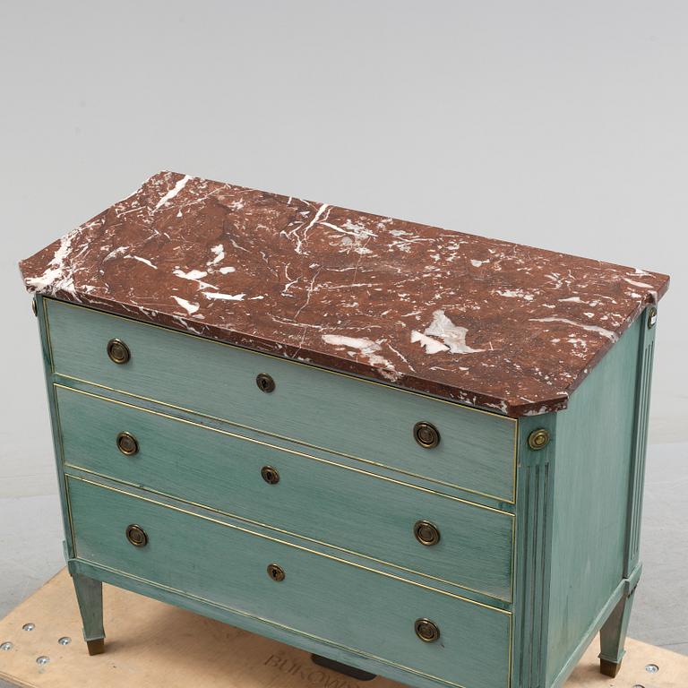 A Gustavian style schest of drawers, mid 20th century.