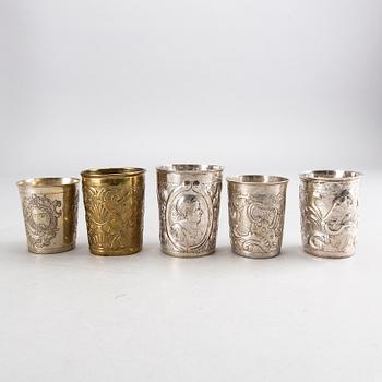 Five Russian 18th century silver and brass beakers, silver weight 292 gr, height ca 7-8,5 cm.