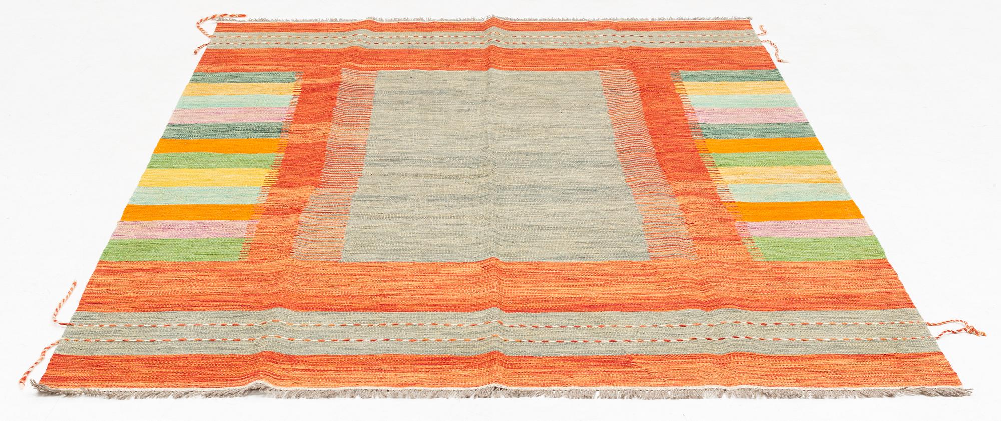 A Kilim rug, c. 245 x 170 cm.