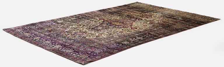 An antique silk Kashan rug, Central Persia, c. 207 x 131 cm.