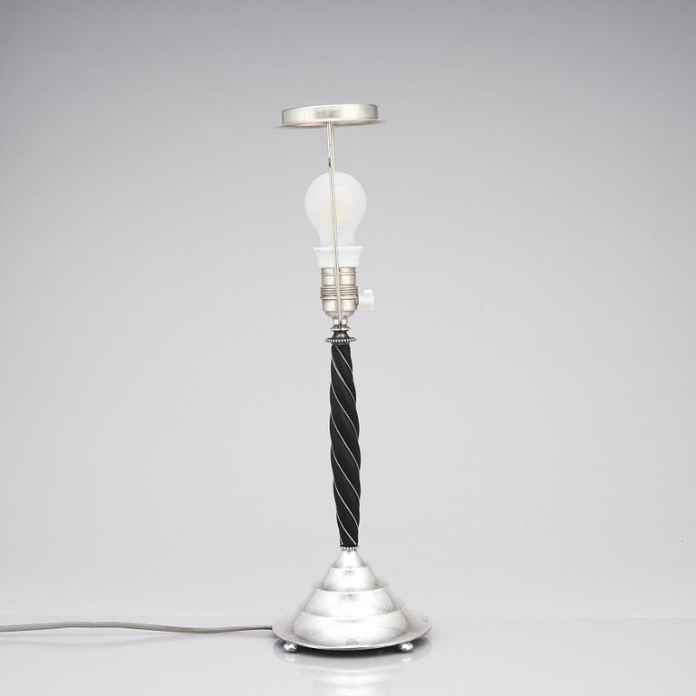 K. Anderson, a silver and blackstained wood table lamp, Stockholm 1926.