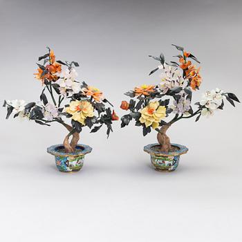 A pair of Chinese table decorations in various stones, enamelled pots. The latter half of the 20th century.