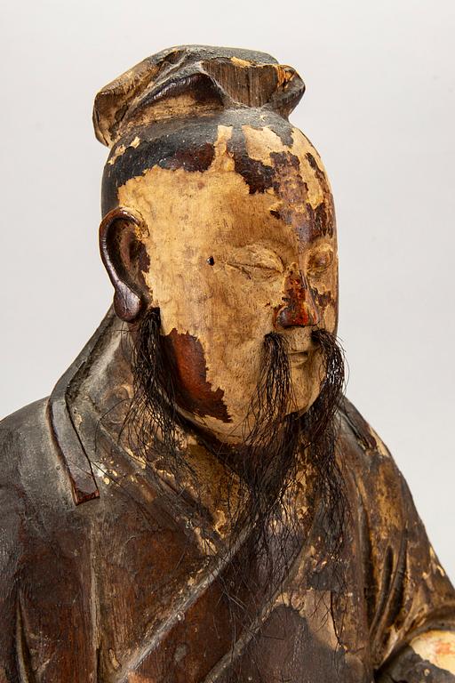 A Chinese late Qing painted wooden sculpture.