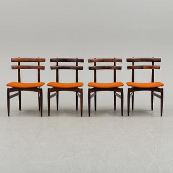 A dining table with four chairs by Poul Hundevad, latter part of 20th century.