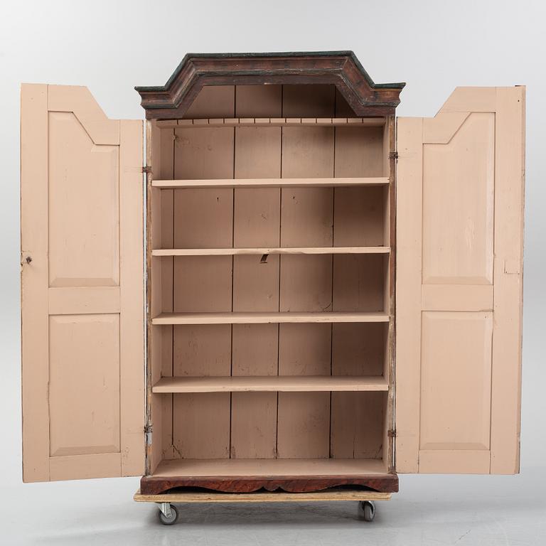 A Swedish painted cupboard dated 1863.