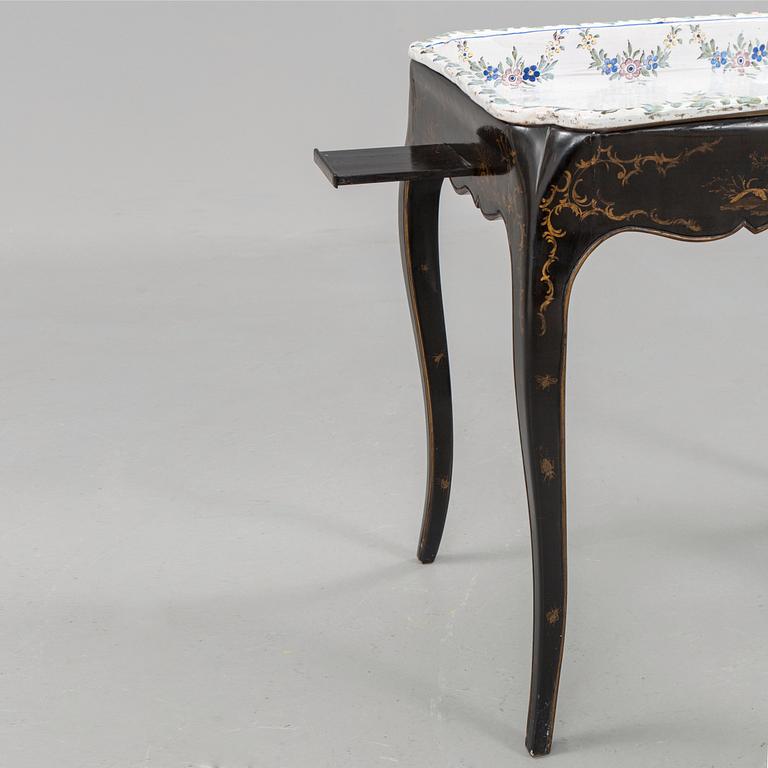 A Swedish Rococo faience tea table, Marieberg 1770.