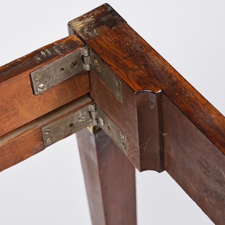 A Gustavian 'concertina action' mahogany games table by Georg Haupt (master in Stockholm 1770-84).
