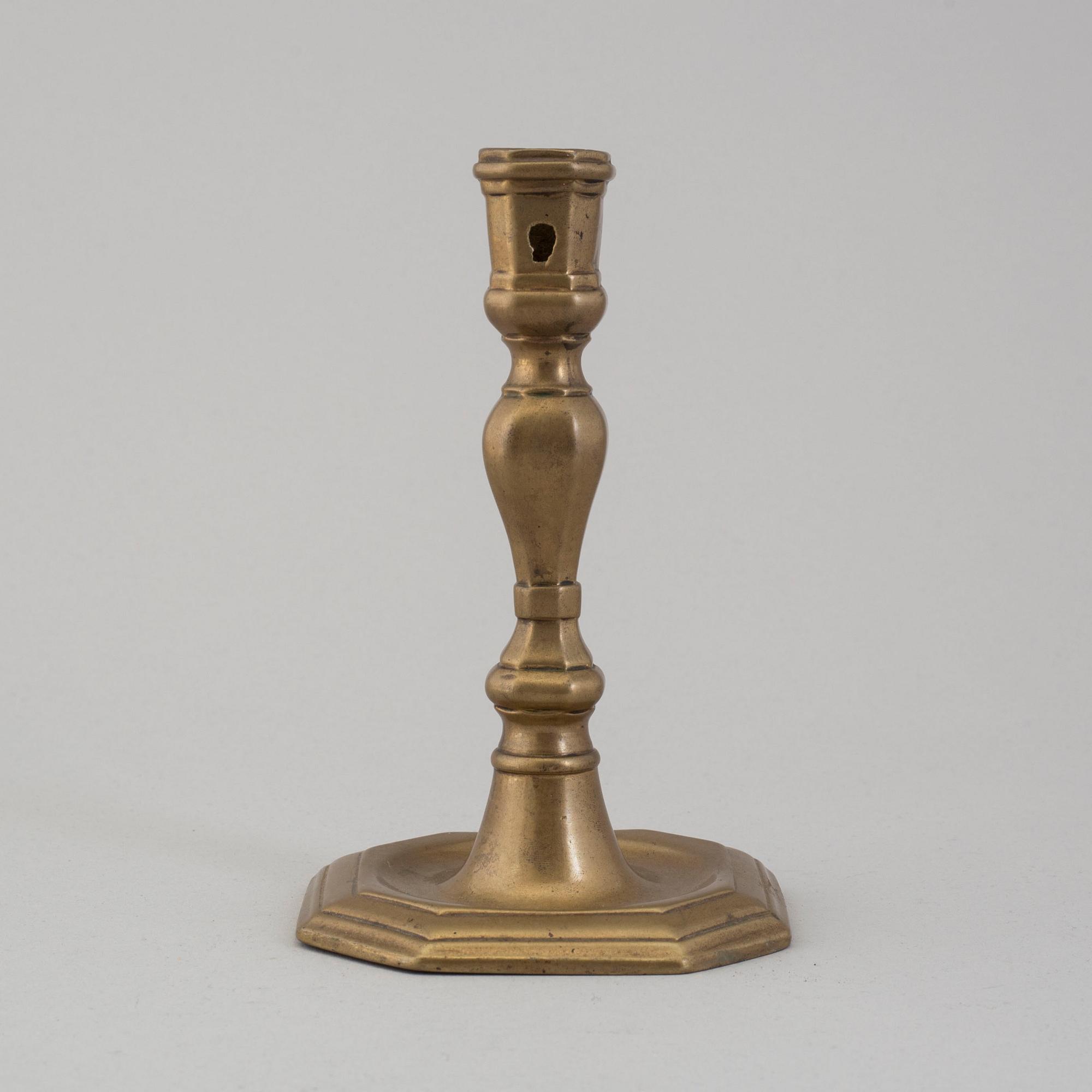 An 18th century bronze candlestick.