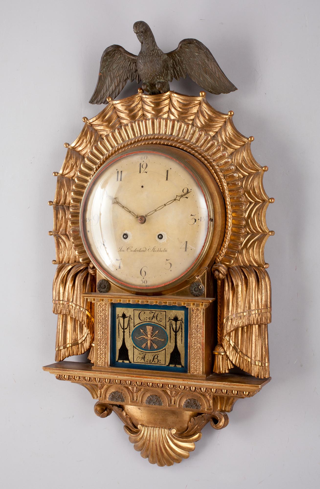A Swedish Empire wall clock by J. Cederlund.