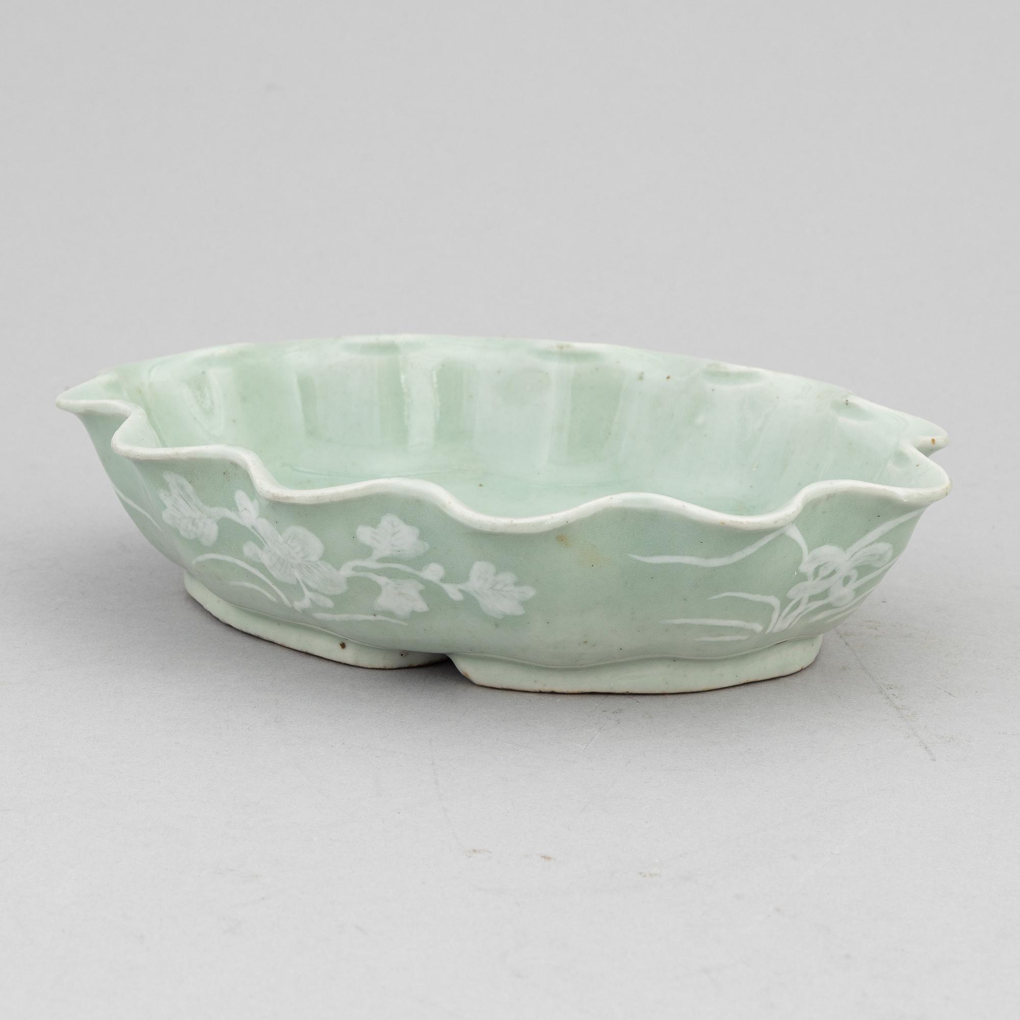 A Chinese celadon glazed lotus leaf shaped bowl, late Qing dynasty, and a ge-glazed brush washer, possibly 20 century.